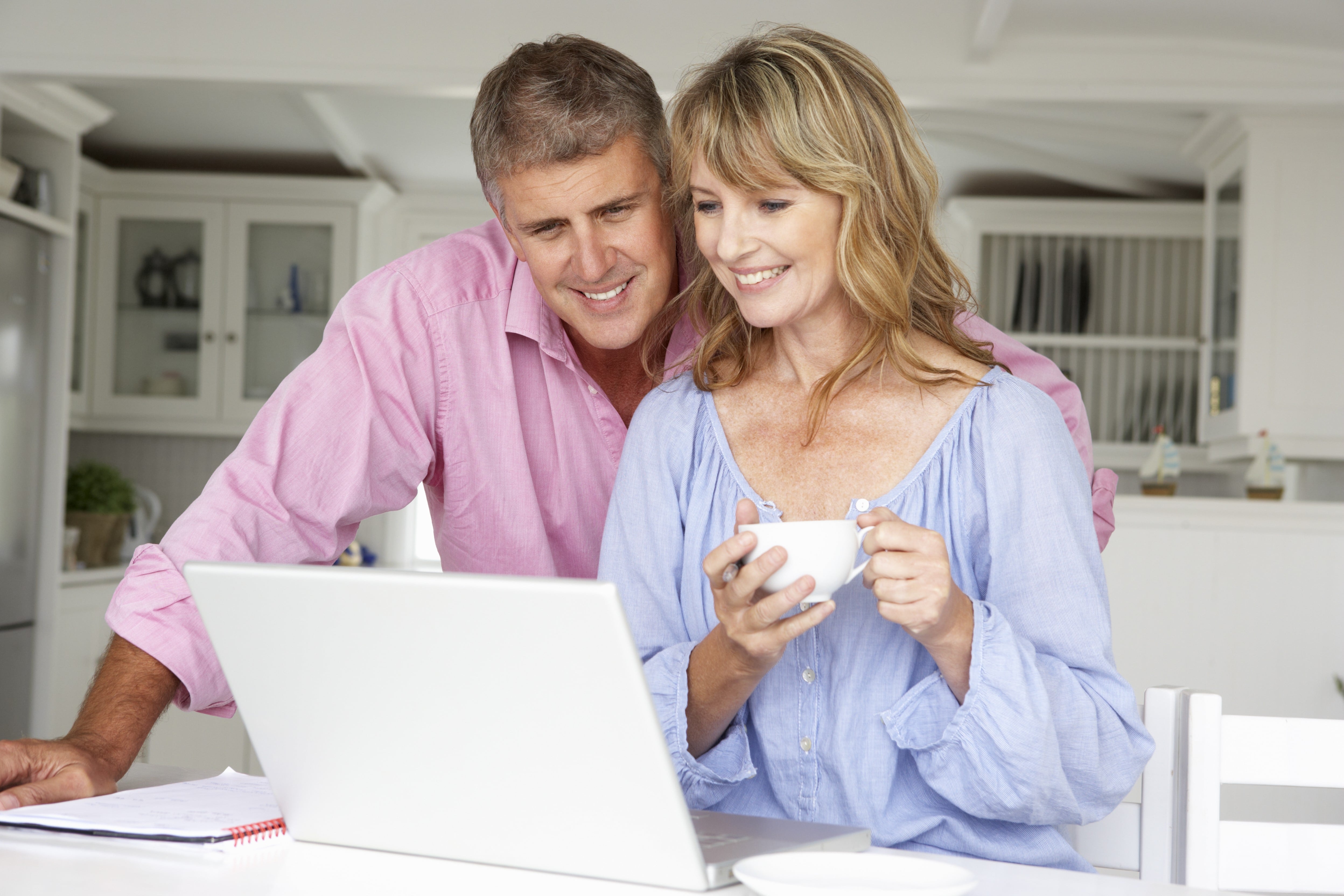 Couple Looking At A Laptop Together 